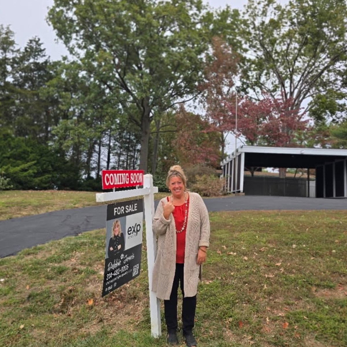 Debbie Jeanis with a recent For Sale sign